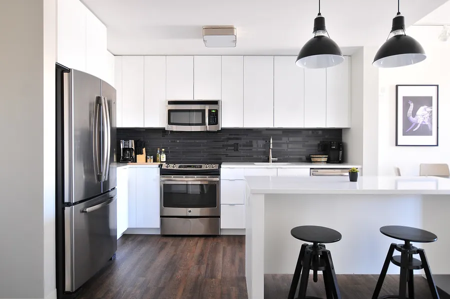 Bright kitchen with full-height fitted cabinets